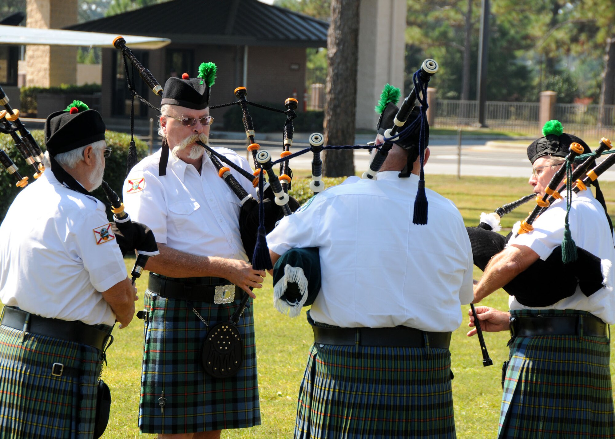Members of the Emerald Coast Pipes and Drums warm up prior to their performance for the Air Commando Association’s memorial ceremony Oct. 10 at Hurlburt Field, Fla.  The 30th anniversary memorial paid tribute to special operators involved in Operations Desert One and Eagle Claw, the ill-fated attempt to rescue American hostages in Iran.  Despite their tragic outcome the operations were credited as the catalyst that led to the formation of United States Special Operations Command and subsequently Air Force Special Operations Command. The ceremony culminated in an MC-130E fly-over by the 711th Special Operations Squadron from Duke Field.  (U.S. Air Force Photo/Staff Sgt. Jonathan McCallum)