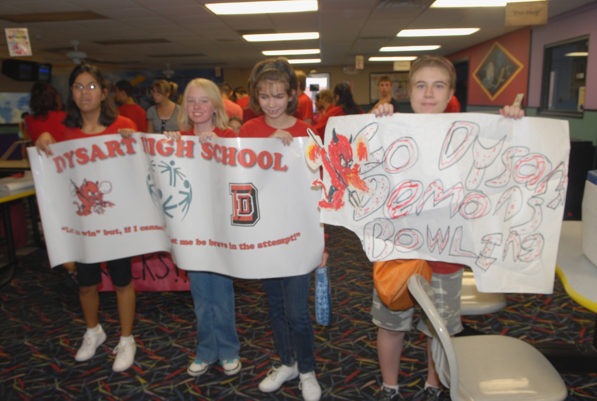 Special needs children from Dysart High School cheer on their classmates while showing their school spirit on October 15th at Thunderbolt Lanes, Luke Air Force Base, Arizona.  (U.S. Air Force photo/Airman 1st Class Melanie Holochwost)