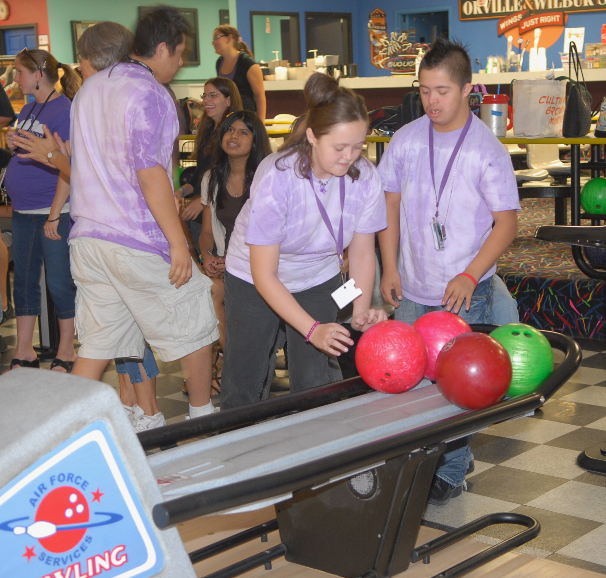 Anthony Adamo gives Jessika Tannehill some advice before she attempts a spare on October 15th at Thunderbolt Lanes, Luke Air Force Base, Arizona.  About 100 special needs children from five schools came to Thunderbolt Lanes to prepare for a Special Olympics bowling tournament being held on November 17th in Avondale, Arizona.  (U.S. Air Force photo/Airman 1st Class Melanie Holochwost)
