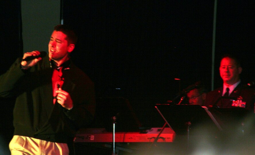 Tech. Sgt. Eric Bailey, from Grand Forks Air Force Base, N.D., sings during the Air Mobility Command Icon competition at Scott Air Force Base, Ill., on Oct. 21, 2010. Sergeant Yager was the base-level winner at Grand Forks and competed with 10 other competitors for the title of "AMC Icon." (U.S. Air Force Photo/Master Sgt. Scott T. Sturkol)