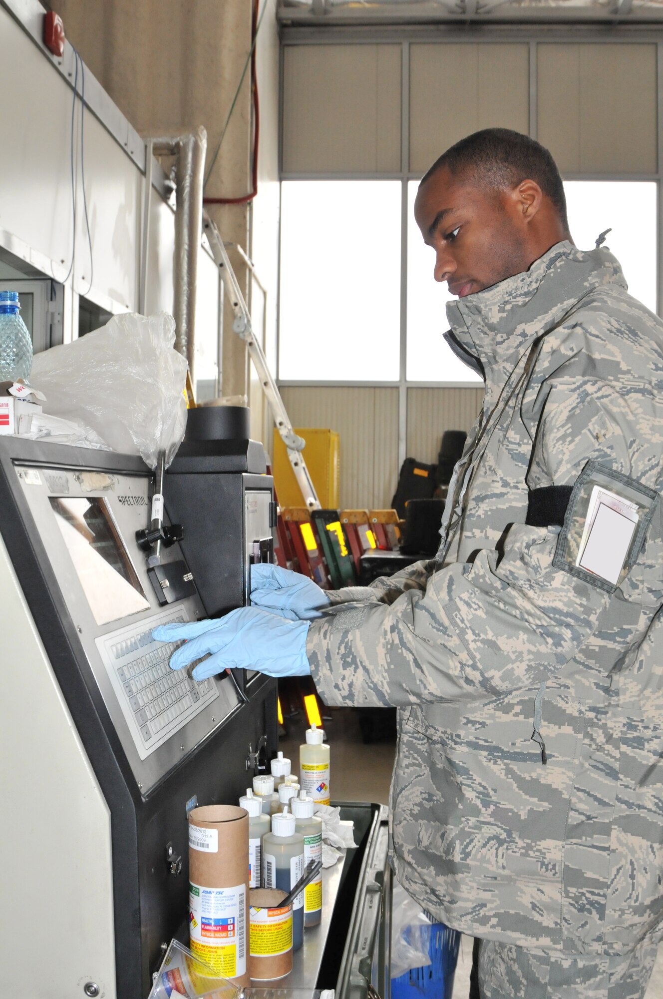Senior Airman Corbin Farries, 48th Equipment Maintenance Squadron calibrates an oil analysis machine Oct. 20 on Campia Turzii Air Base, Romania. The machine analyses the composition of oil taken from an aircraft in order to predict possible engine malfunctions. Airman Farries is in Romania for Operation Golden Lance, a partnership-building exercise with the Romanian Air Force. (U.S. Air Force photo/Senior Airman David Dobrydney)

