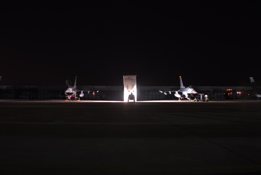 Maintainers from Kunsan Air Base, Republic of Korea, go though post-flight checks on F-16 Fighting Falcon aircraft Oct. 20 during exercise Max Thunder 10-2 at Kwangju AB, ROK. (U.S. Air Force photo/Staff Sgt. Eric Burks)