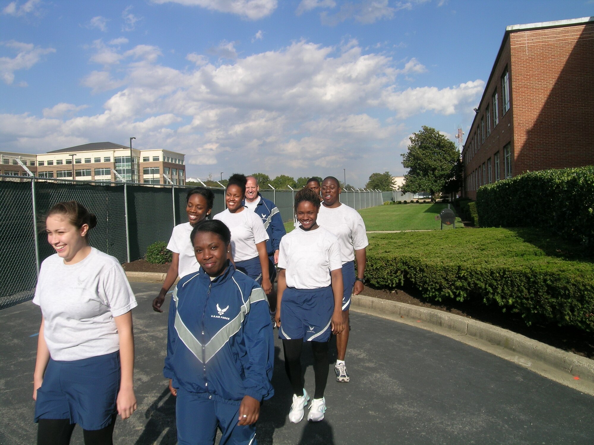 Not just a walk in the park, but a walk around the base is what Air Force District of Washington Command Chief Master Sgt. Pat Battenberg had in mind when he invited the AFDW HQ executive and support staff to go for a walk Oct 21, at Andrews AFB, Md. Pictured from left to right are: Airman 1st Class Mary E. Fifer, Technical Sgt. Bridget London, Senior Airman Tiffany Miles, Airman 1st Class Marquita Allen, Senior Airman Pauline Rose, Staff Sgt. Jeffery Rush, Senior Airman Clary Griffin and Command Chief Master Sgt. Pat Battenberg. (Photo by Aletha Frost, AFDW/PA)