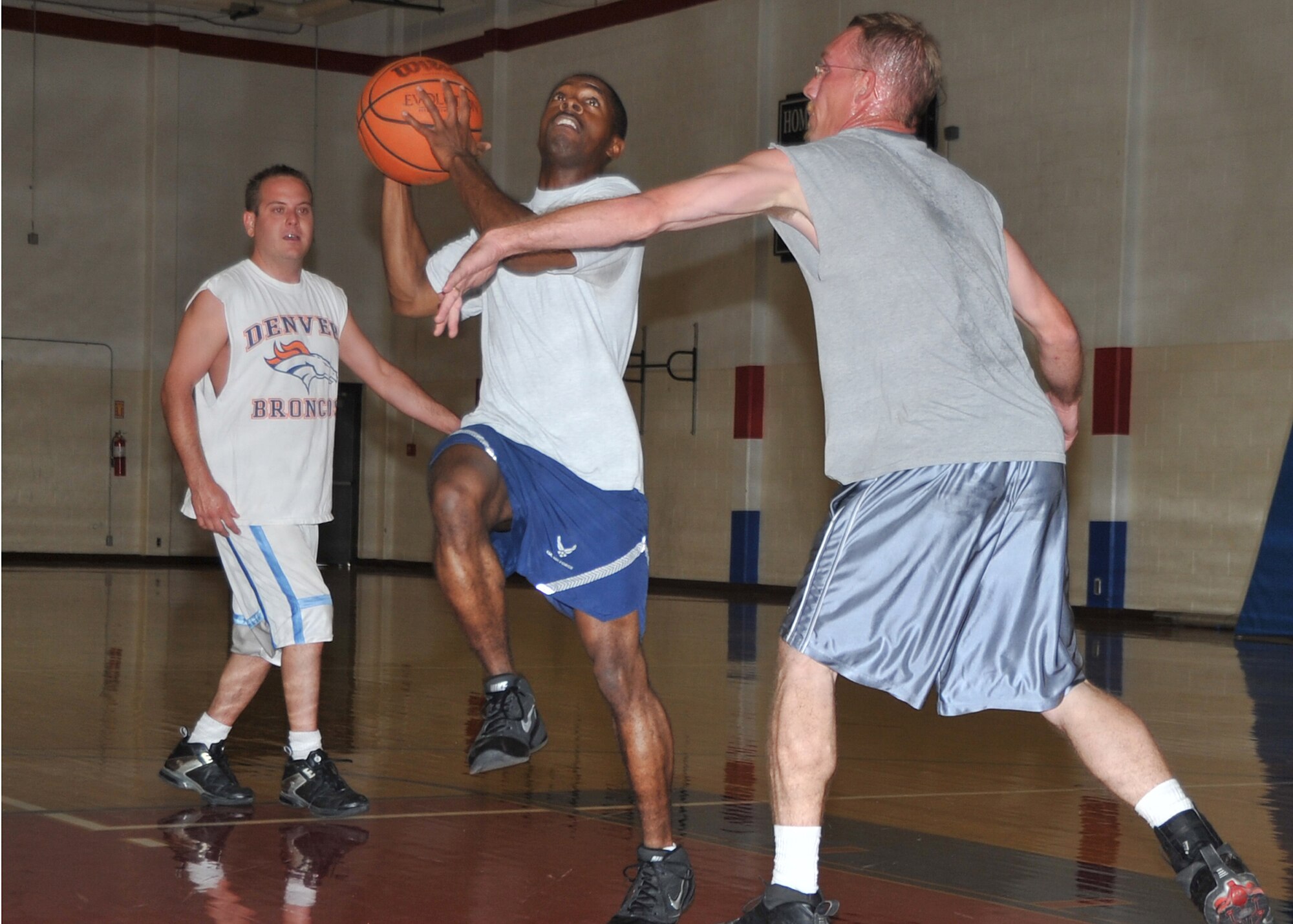 Staff Sgt. Daniel Treadway, 377th Security Forces Squadron, lays up a shot in the 3 on 3 basketball tournament Oct. 13 as part of Wing Sports Day events at the East Fitness Center.  U.S. Air Force Photo by Todd Berenger