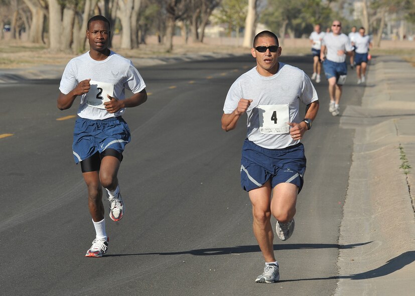 Senior Airman Gene Davila, 377th Aerospace Medicine Squadron, leads in the 5k run Oct. 13 as part of Wing Sports Day events.  U.S. Air Force Photo by Todd Berenger
