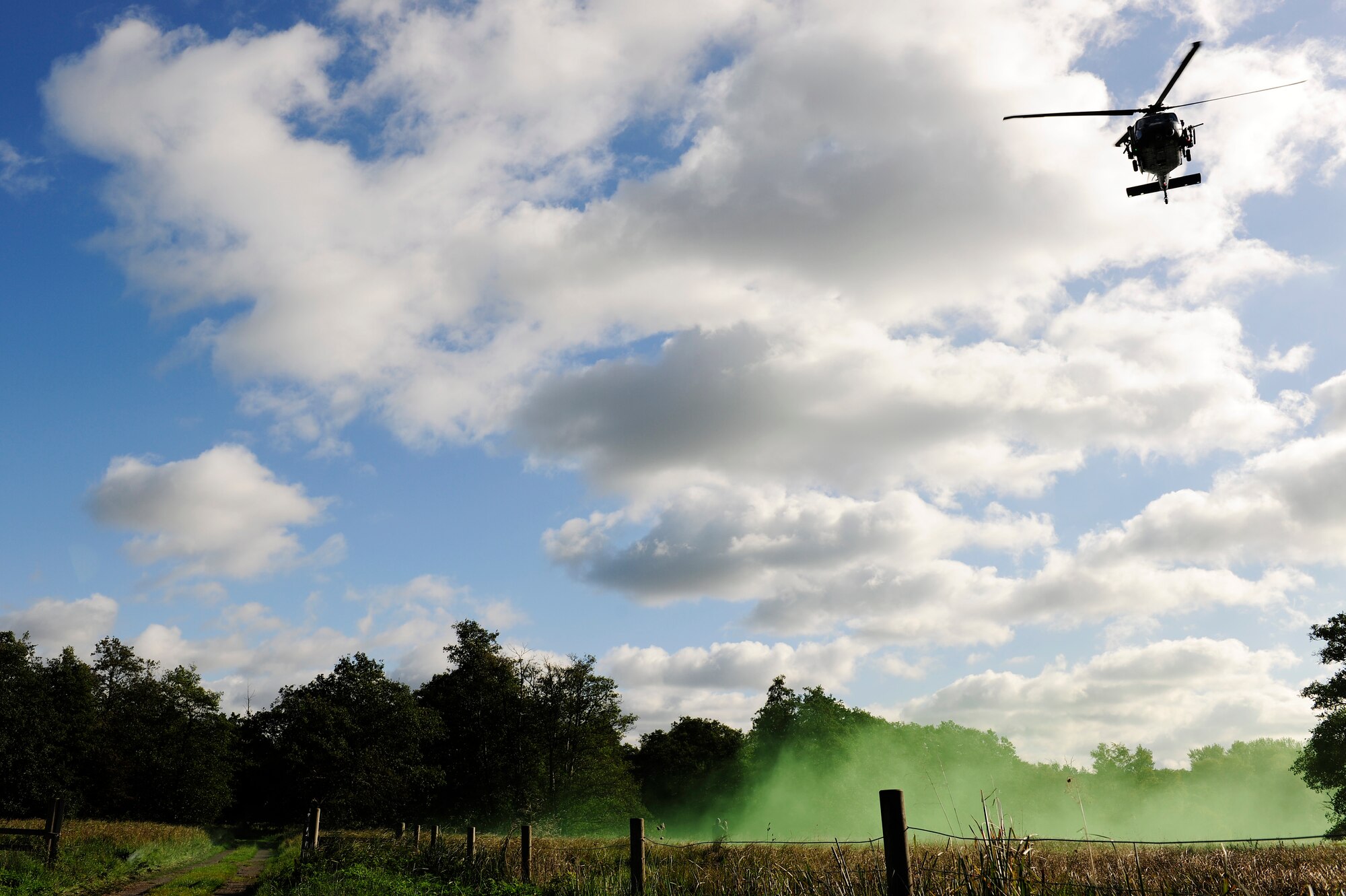STANFORD TRAINING AREA, England – An HH-60G Pavehawk helicopter prepares to air land and drop off remaining dive equipment for the 56th Rescue Squadron pararescuemen Oct. 20. The pararescuemen were preparing to aid British ground forces and conduct underwater scuba operations. (U.S. Air Force photo/Airman 1st Class Lausanne Morgan) 