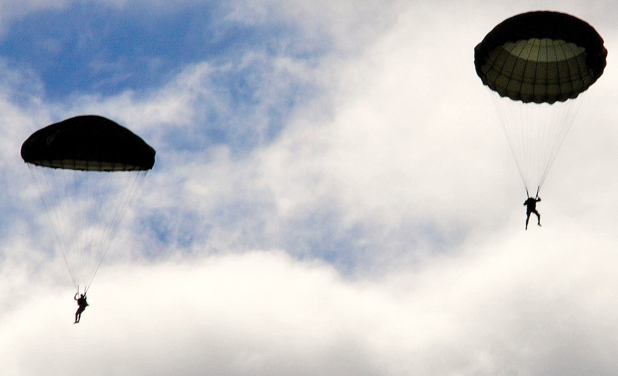 U.S. and Bulgarian Air Force paratroopers jump from a Ramstein based C-130J, Super Hercules over the skies of Plovdiv, Bulgaria, Oct. 20. The U.S. Airmen are deployed from the 37th Airlift Squadron, Ramstein Air Base, Germany, to support Thracian Fall 2010 a two week on-site training deployment designed to build the partnership between the U.S. and Bulgarian Air Force. (U.S. Air Force photo by Tech. Sgt. Michael Voss)