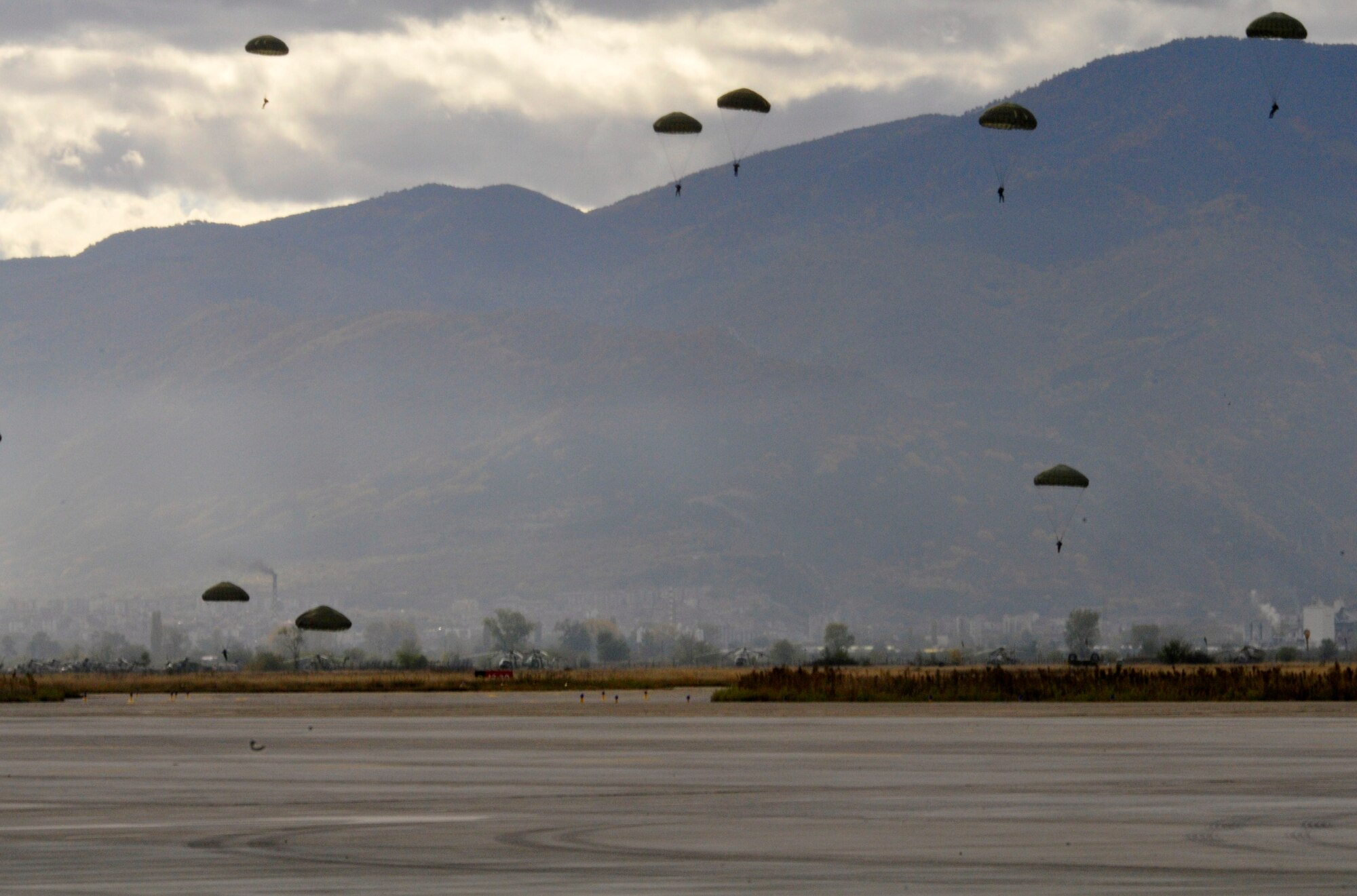 U.S. and Bulgarian Air Force paratroopers jump from a Ramstein based C-130J, Super Hercules over the skies of Plovdiv, Bulgaria, Oct. 20. The U.S. Airmen are deployed from the 37th Airlift Squadron, Ramstein Air Base, Germany, to support Thracian Fall 2010 a two week on-site training deployment designed to build the partnership between the U.S. and Bulgarian Air Force. (U.S. Air Force photo by Tech. Sgt. Michael Voss)