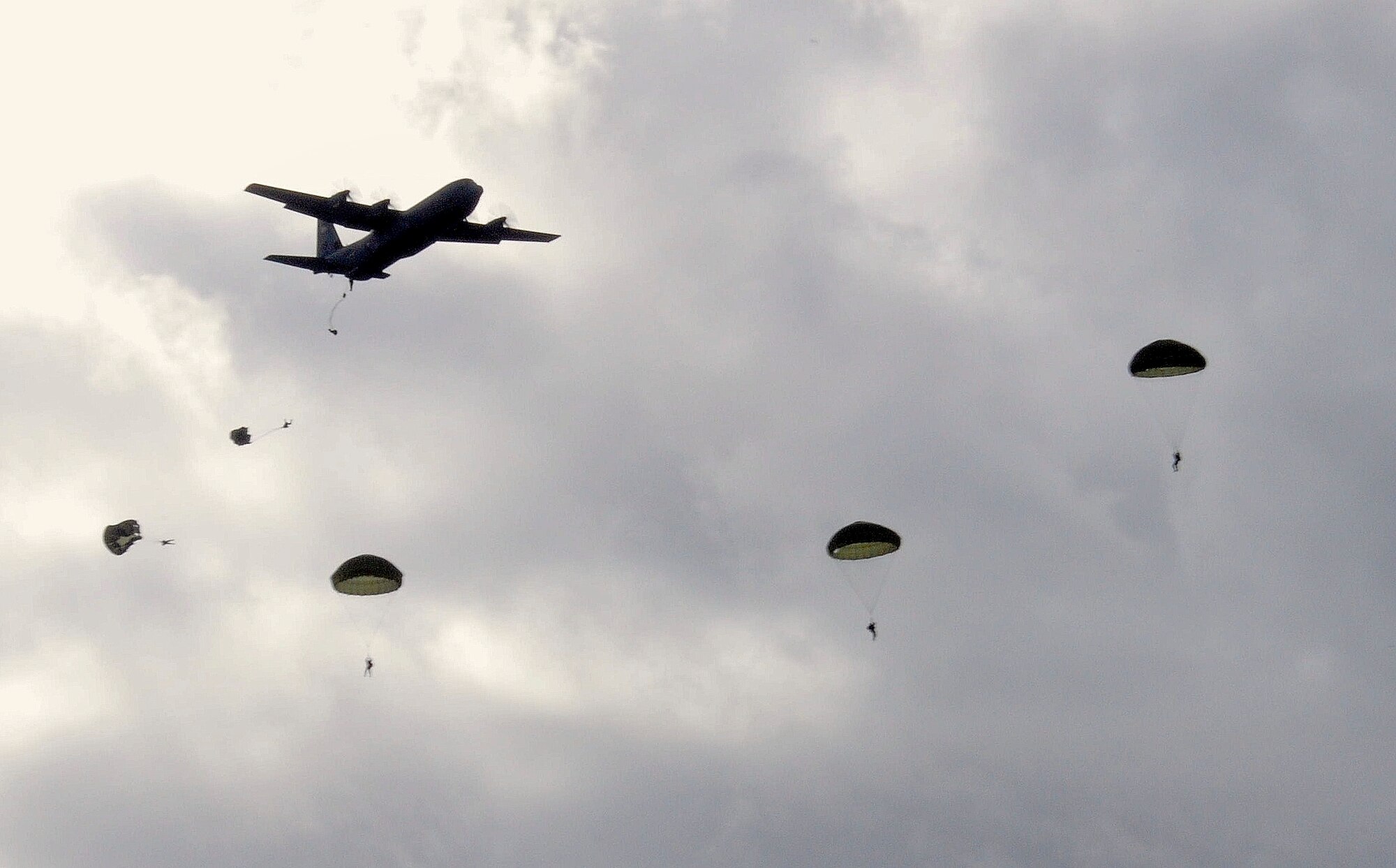 U.S. and Bulgarian Air Force paratroopers jump from a Ramstein based C-130J, Super Hercules over the skies of Plovdiv, Bulgaria, Oct. 20. The U.S. Airmen are deployed from the 37th Airlift Squadron, Ramstein Air Base, Germany, to support Thracian Fall 2010 a two week on-site training deployment designed to build the partnership between the U.S. and Bulgarian Air Force. (U.S. Air Force photo by Tech. Sgt. Michael Voss)