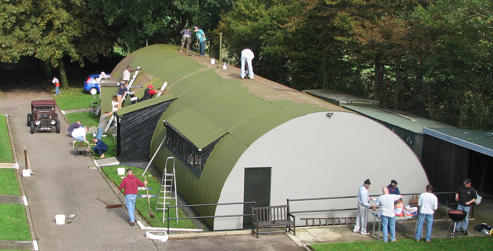RAF MILDENHALL, England -- Airmen from the 100th Air Refueling Wing provide painting services at the 100th Bombardment Group Memorial Museum at Thorpe Abbotts airfield Oct. 2. These volunteers helped renew parts of the site, which houses much of the heritage of the 100th ARW, a descendent of the 100th BG in World War II. (courtesy photo/Becky Ramsey)