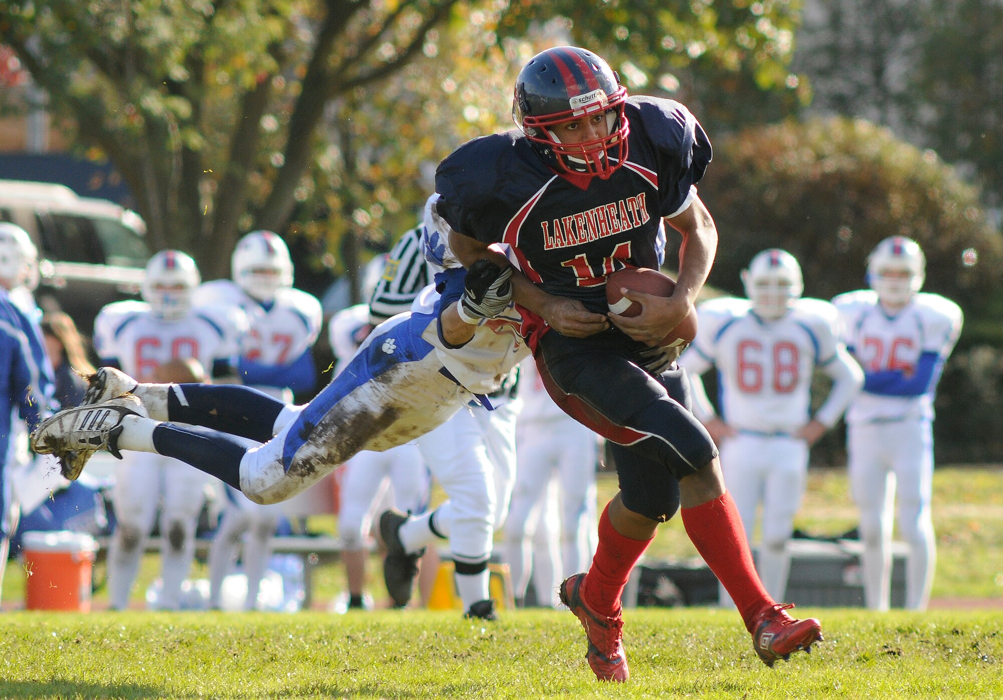 Xavier Thompson,Lakenheath Lancers running back, runs the ball down the field during the Homecoming game versus the Ramstein Royals Oct. 16. Homecoming is the last home game of the season and is part of Lakenheath High School "spirit week". (U.S. Air Force photo/Tim Barlow)
