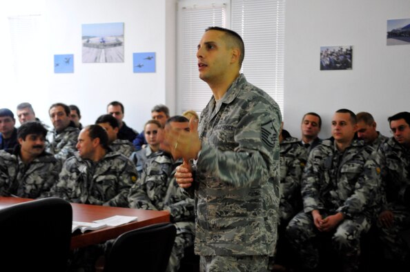 U.S. Air Force Master Sgt.John Carbon mentors members of the Bulgarian Air Force on the roles and responsibilities of Airmen during an enlisted leadership seminar at Ignatievo Air Base, Bulgaria, Oct. 21.Sergeant Carbon is a deployed first sergeant from the 37th Airlift Squadron, Ramstein Air Base, Germany, supporting Thracian Fall 2010. Thracian Fall is a two week on-site training deployment designed to foster the partnership between the U.S. and Bulgarian Air Force. (U.S. Air Force photo by Tech. Sgt. Michael Voss) 


