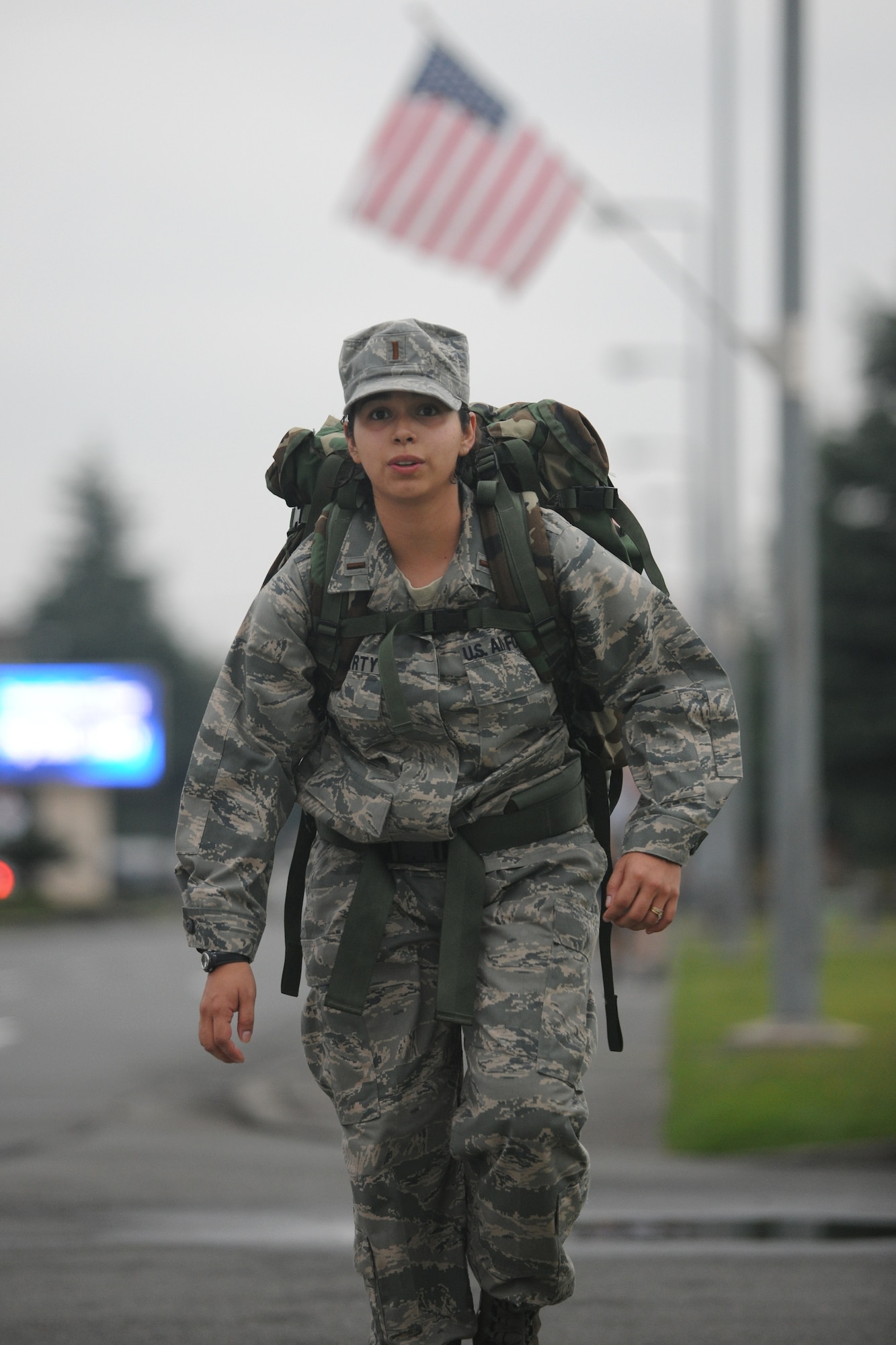 YOKOTA AIR BASE, Japan -- 2nd Lt. Diana Halferty, 374th Logistics Readiness Squadron, carries a 30 pound backpack here Oct. 22 during the Fifth Air Force monthly ruck march. 55 Yokota Airmen participated in the 6 mile march. (U.S. Air Force photo/Osakabe Yasuo)