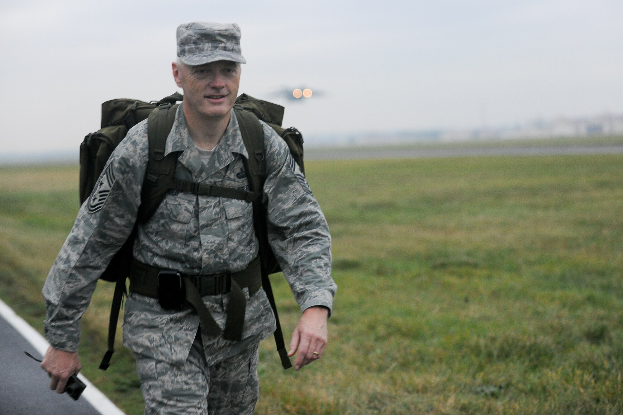 YOKOTA AIR BASE, Japan -- Command Chief Master Sgt. Richard Kaiser, U.S. Forces, Japan and Fifth Air Force, participates in a 6 mile ruck march here Oct. 22. 55 Yokota Airmen participate in the march, each carrying a minimum 30 pound backpack. (U.S. Air Force photo/Osakabe Yasuo)