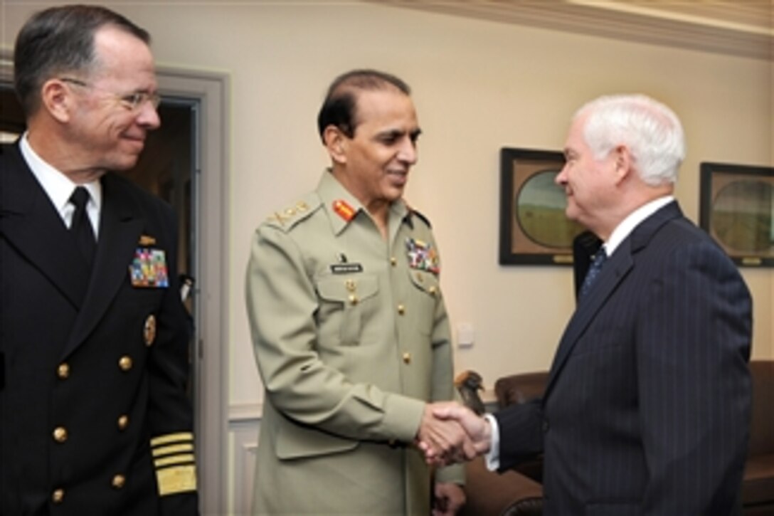 Secretary of Defense Robert M. Gates (right) welcomes Chief of the Pakistani Army Staff Gen. Ashfaq Kayani to his Pentagon office for security discussions on Oct. 20, 2010.  Chairman of the Joint Chiefs of Staff Adm. Mike Mullen (left) also participated in the talks.  