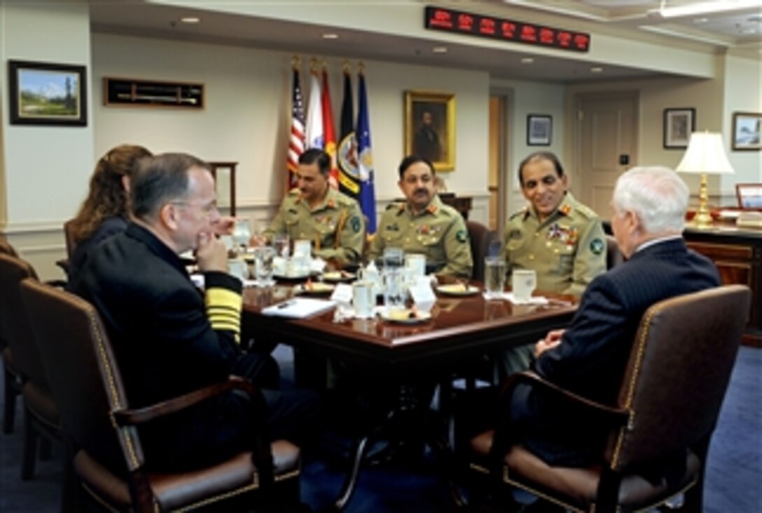 Secretary of Defense Robert M. Gates (right) hosts a meeting in the Pentagon with Chief of the Pakistani Army Staff Gen. Ashfaq Kayani (2nd from right).  Chairman of the Joint Chiefs of Staff Adm. Mike Mullen (2nd from left) and Under Secretary of Defense for Policy Michele Flournoy (left) also participated.  