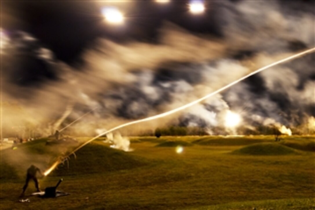 Flares and artillery simulators light up the sky during the M4 rifle night qualification event during the annual U.S. Army's Best Warrior Competition on Fort Lee, Va., Oct. 21, 2010. The competition is the premier event to determine the top noncommissioned officer and junior enlisted soldier in the Army.