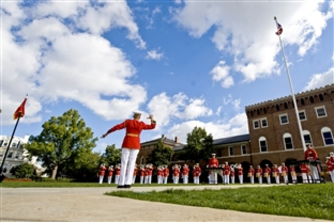 The United States Marine Corps Drum and Bugle Corps performs during a Passage of Command ceremony at the Marine Barracks, Washington, D.C., Oct. 22, 2010. Marine Corps Gen. James T. Conway relinquished command as commandant to Gen. James F. Amos in a ceremony presided over by Defense Secretary Robert M. Gates.