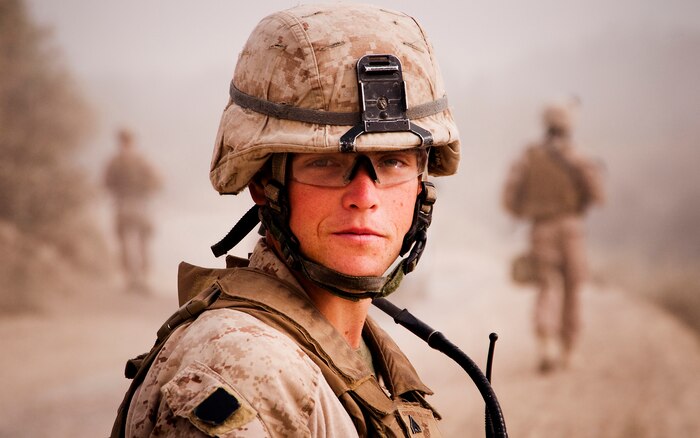 Cpl. Brandon Owensby, a radio operator with Jump Platoon, 3rd Battalion, 3rd Marine Regiment, looks back during a patrol while escorting media through the Nawa Bazaar in Helmand province, Afghanistan, Oct. 22, 2010. Jump Platoon’s primary mission is to provide security for the battalion commander and transport him throughout 3/3’s battle space, but the platoon performs a variety of tasks from providing supplementary security and running vehicle checkpoints, to masonry and gardening. (Official Marine Corps photo by Sgt. Mark Fayloga)