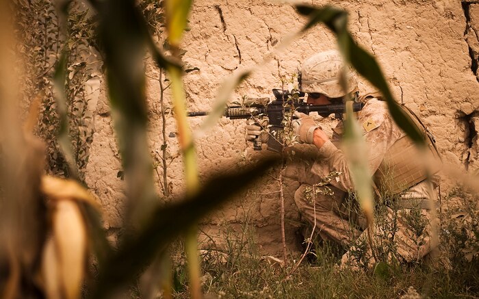 Pfc. Steven L. Blizzard, a driver with Jump Platoon, 3rd Battalion, 3rd Marine Regiment, provides security while escorting media through the Nawa Bazaar in Helmand province, Afghanistan, Oct. 22, 2010. Jump Platoon’s primary mission is to provide security for the battalion commander and transport him throughout 3/3’s battle space, but the platoon performs a variety of tasks from providing supplementary security and running vehicle checkpoints, to masonry and gardening. Blizzard is from Clare, Mich.