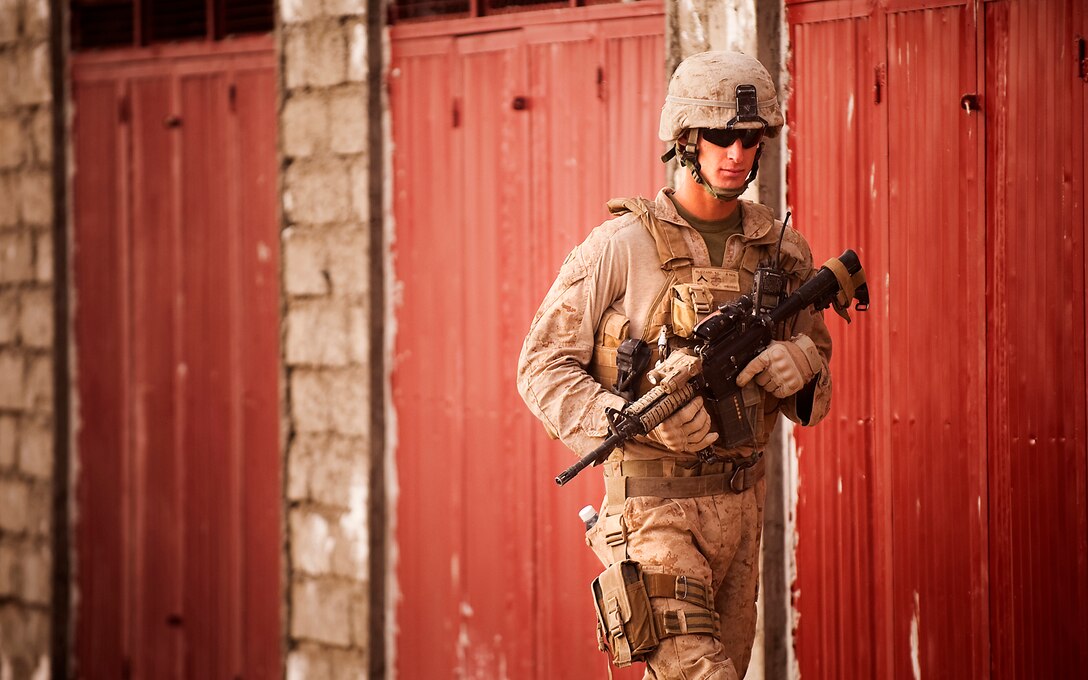 Pfc. Steven L. Blizzard, a driver with Jump Platoon, 3rd Battalion, 3rd Marine Regiment, provides security while escorting media through the Nawa Bazaar in Helmand province, Afghanistan, Oct. 22, 2010. Jump Platoon’s primary mission is to provide security for the battalion commander and transport him throughout 3/3’s battle space, but the platoon performs a variety of tasks from providing supplementary security and running vehicle checkpoints, to masonry and gardening. Blizzard is from Clare, Mich.