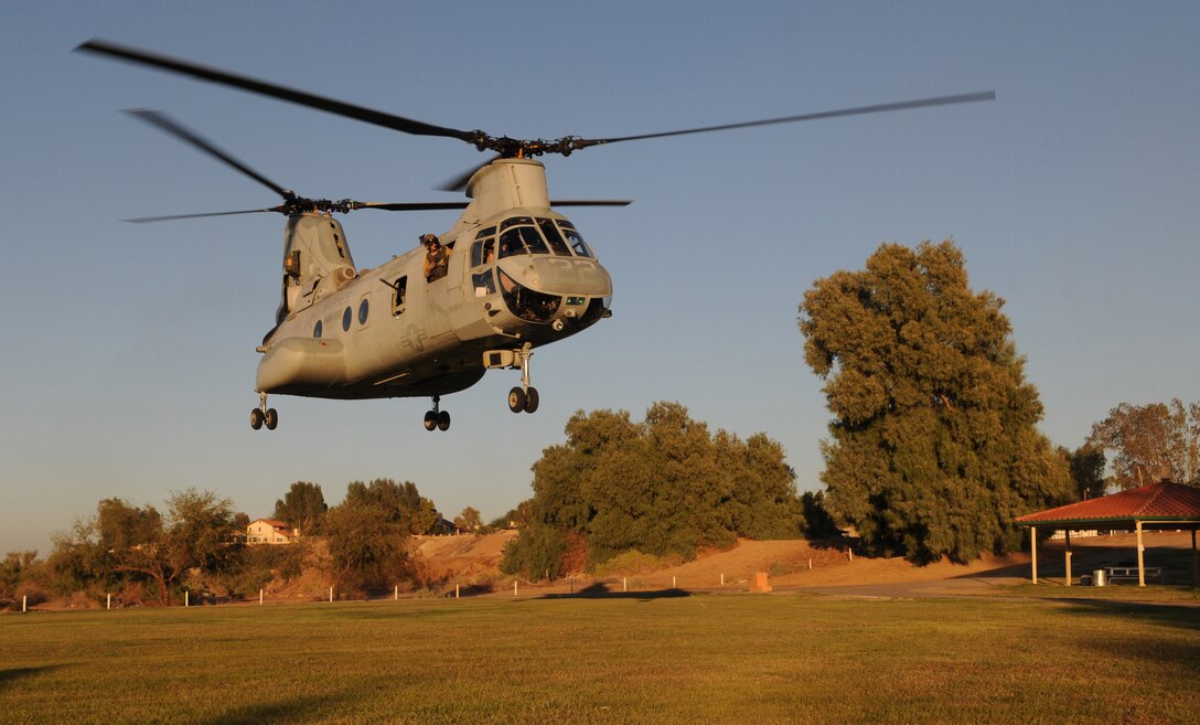 Shortly after dropping off Marines from E Company, 2nd Battalion, 7th Marine Regiment, a CH-46 Sea Knight departs from Pat Williams Park in Brawley, Calif., Oct. 22, 2010. As part of the Weapons and Tactics Instructor course taught at Marine Corps Air Station Yuma, Ariz., different aircrafts transported Marines for the noncombatant evacuation operation, which simulates extracting American citizens from an American embassy in hostile territory.