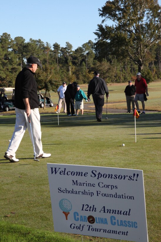 Members of the eastern North Carolina community and military members practice putting at Paradise Point Golf Course, at Marine Corps Base Camp Lejeune, during the 12th annual Carolina Classic Golf Tournament, Oct. 23.  The weekend tournament raised more than $200,000 for scholarships to benefit Marine children.