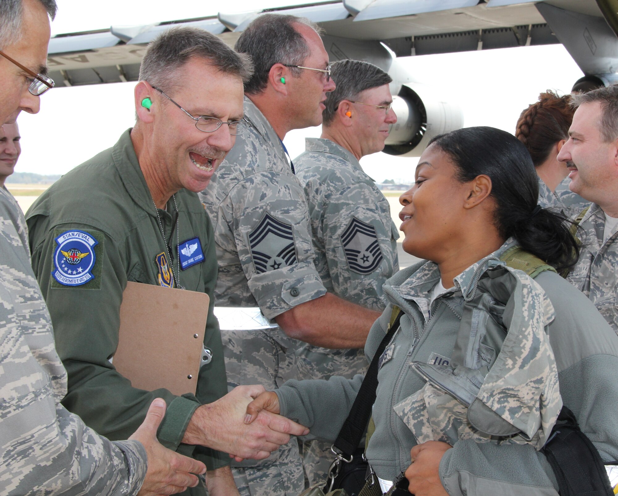 Chief Master Sgt. Shane Cayson welcomes Tech. Sgt. Stepanie Threats back from a week-long ORI (operational readiness inspection.)  Some 200 Reservists from the 932nd Airlift Wing participated in the fast-paced event.  The ORI's are used to evaluate a unit's readiness and contingency skills. (U.S. Air Force photo/Tech. Sgt. Dan Oliver) 