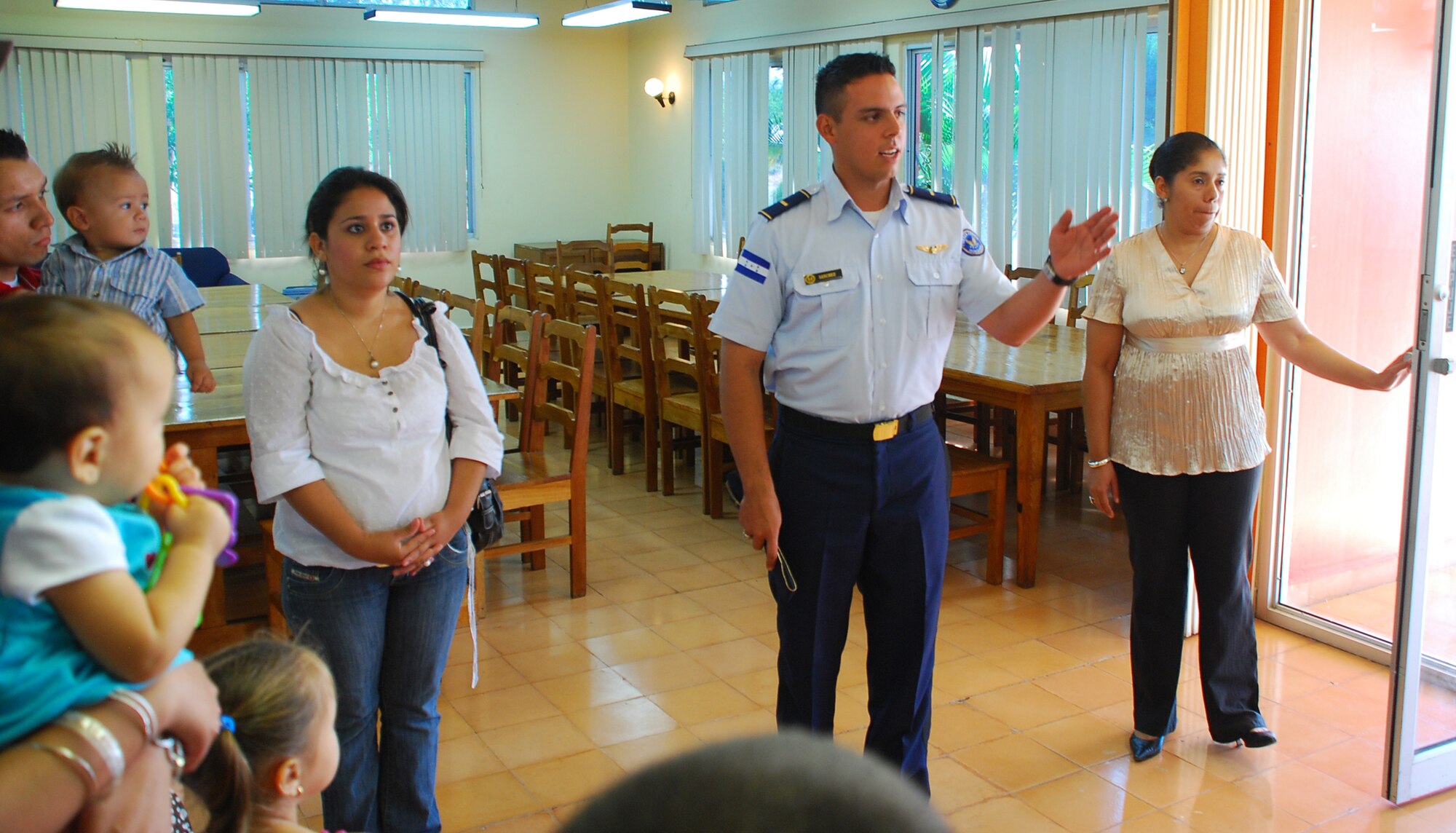 SOTO CANO AIR BASE, Honduras --  A Honduran Air Force Academy officer gives a guided tour of their facility to foreign service nationals and their family members during FSN Family Day here Oct. 22. FSN Family Day was hosted by the leadership of Joint Task Force-Bravo and the Honduran Air Force Academy. (U.S. Air Force photo/Capt. John Stamm)