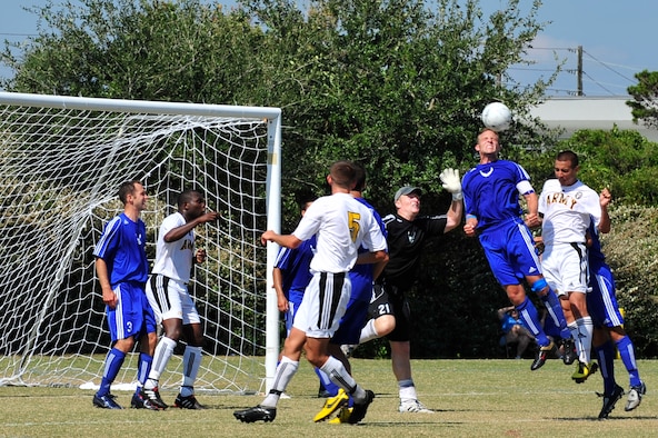 U.S. Air Force Capt Clay McGillivary, midfielder for the Air Force soccer team, heads the ball during an Armed Forces Men's Soccer Championship Semifinal match against the U.S. Army at Morgan Sports Complex, Destin, Fla., Oct. 23, 2010. The Armed Forces Championships are conducted by the Armed Forces Sports council for the purpose of promoting, understanding, goodwill, and competition among the Armed Services. Captain McGillivary is stationed at Malmstrom AFB, Mt. (DoD Photo by Staff Sgt. Stephanie Jacobs/RELEASED)