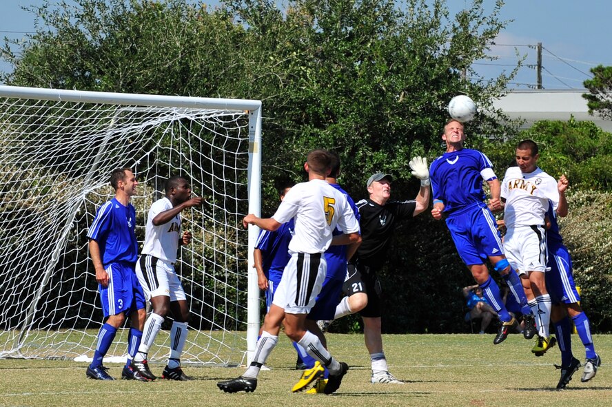 U.S. Air Force Capt Clay McGillivary, midfielder for the Air Force soccer team, heads the ball during an Armed Forces Men's Soccer Championship Semifinal match against the U.S. Army at Morgan Sports Complex, Destin, Fla., Oct. 23, 2010. The Armed Forces Championships are conducted by the Armed Forces Sports council for the purpose of promoting, understanding, goodwill, and competition among the Armed Services. Captain McGillivary is stationed at Malmstrom AFB, Mt. (DoD Photo by Staff Sgt. Stephanie Jacobs/RELEASED)