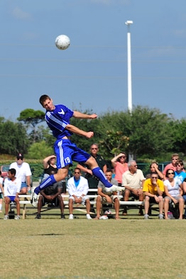 U.S. Air Force Capt. Thomas Petykowski a defender for the Air Force soccer team, heads the ball during an Armed Forces Men's Soccer Championship Semifinal match against the U.S. Army at Morgan Sports Complex, Destin, Fla., Oct. 23, 2010. The Armed Forces Championships are conducted by the Armed Forces Sports council for the purpose of promoting, understanding, goodwill, and competition among the Armed Services. Captain Petykowski is stationed at Dover AFB, De. (DoD Photo by Staff Sgt. Stephanie Jacobs/RELEASED)