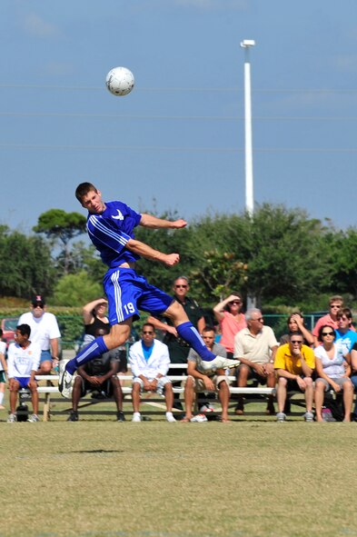 U.S. Air Force Capt. Thomas Petykowski a defender for the Air Force soccer team, heads the ball during an Armed Forces Men's Soccer Championship Semifinal match against the U.S. Army at Morgan Sports Complex, Destin, Fla., Oct. 23, 2010. The Armed Forces Championships are conducted by the Armed Forces Sports council for the purpose of promoting, understanding, goodwill, and competition among the Armed Services. Captain Petykowski is stationed at Dover AFB, De. (DoD Photo by Staff Sgt. Stephanie Jacobs/RELEASED)