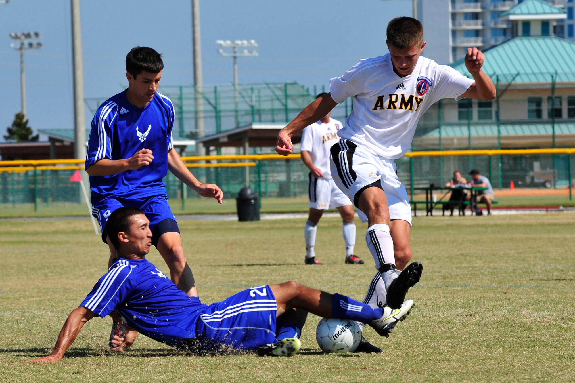 U.S. Air Force Capt. Jason Belvill slide tackles U.S. Army Sgt. Tyler Stratford during an Armed Forces Men's Soccer Championship Semifinal match against the U.S. Army at Morgan Sports Complex, Destin, Fla., Oct. 23, 2010. The Armed Forces Championships are conducted by the Armed Forces Sports council for the purpose of promoting, understanding, goodwill, and competition among the Armed Services. (DoD Photo by Staff Sgt. Stephanie Jacobs/RELEASED)


