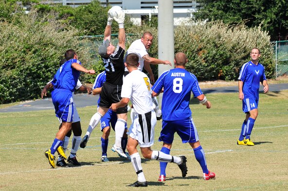 U.S. Air Force Maj. Thomas Butler, goalie for the Air Force soccer team, catches the ball during an Armed Forces Men's Soccer Championship Semifinal match against the U.S. Army at Morgan Sports Complex, Destin, Fla., Oct. 23, 2010. The Armed Forces Championships are conducted by the Armed Forces Sports council for the purpose of promoting, understanding, goodwill, and competition among the Armed Services. Major Butler is stationed at Robbins AFB, Ga. (DoD Photo by Staff Sgt. Stephanie Jacobs/RELEASED)