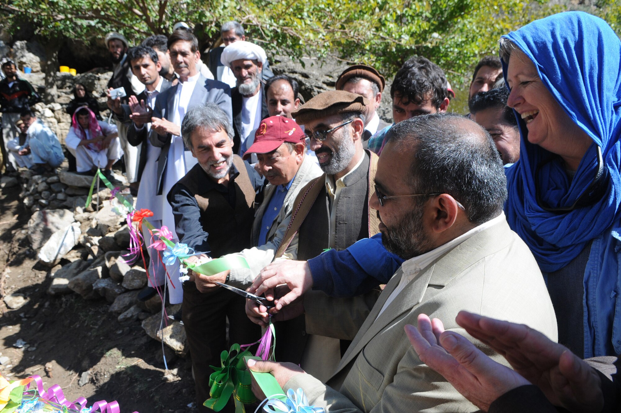 Elizabeth Smithwick, U.S. Agency for International Development lead field officer at Panjshir Provincial Reconstruction Team and acting Panjshir PRT director, along with the Afghanistan Sustainable Water Supply and Sanitation project?s technical advisor, the SWSS program chief of party, and the Panjshir deputy governor, cut a ribbon symbolizing the first Panjshir Sustainable Water Supply and Sanitation project in the Anaba District.  The SWSS project seeks to increase access to potable water and sanitation services in poor communities, decrease the incidence of water-related diseases through household hygiene interventions, and improve the sustainable management of potable water quality and quantity in project-assisted communities.  Contractors have broken ground on three of the eight project sites in Panjshir. (USAF photo by: Tech. Sgt. Sean Mateo White, Panjshir PRT Photographer)
