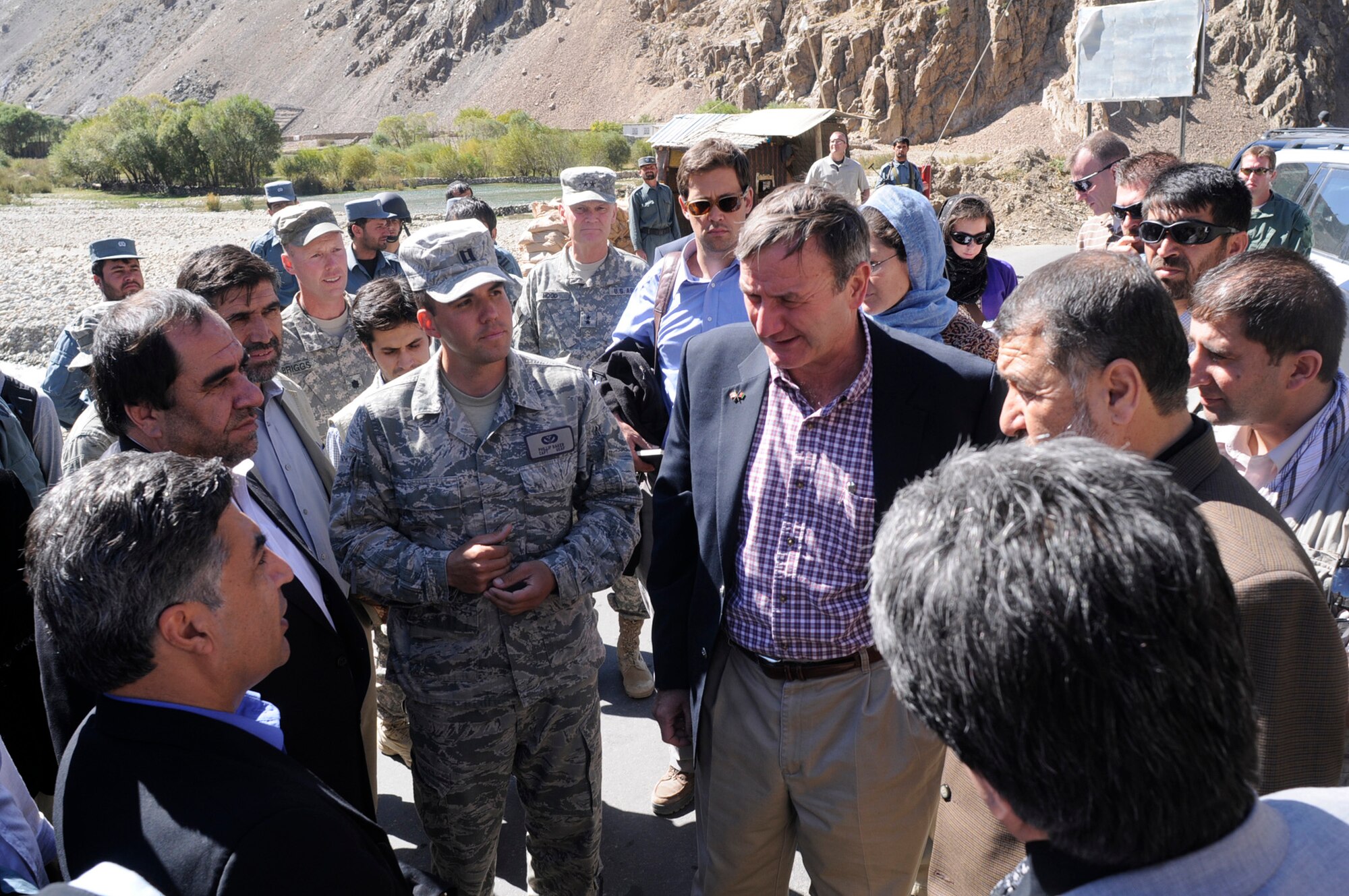 Karl Eikenberry, the U.S. Ambassador to Afghanistan, the Afghan Minister of Interior, the Afghan Minister of Public Works and the Panjshir Provincial Governor discuss current and future road construction with U.S. Air Force Capt. Phillip Baker, Panjshir Provincial Reconstruction Team engineer and San Antonio native, in the Khenj District Oct. 7. Ambassador Eikenberry visited the province to meet with the Panjshir PRT and provincial government officials in order to discuss various provincial issues. (U.S. Air Force Photo by Tech. Sgt. Sean White, Panjshir PRT Public Affairs Photographer)