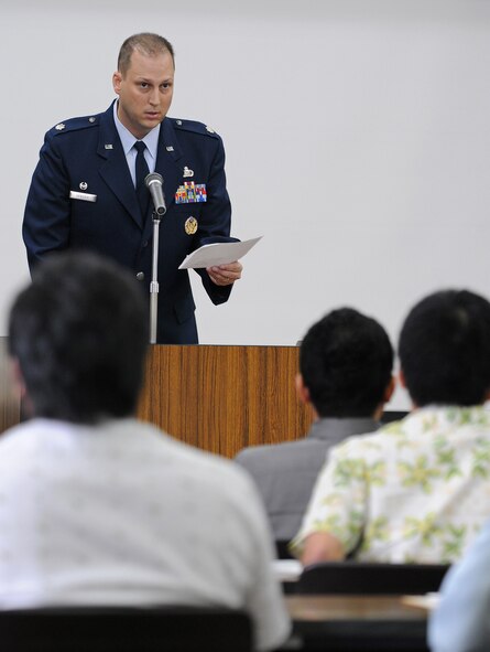 Lt. Col. Phillip Hendrix, 18th Contracting Squadron commander, welcomes local contractors during a Kadena Air Base orientation seminar in Urasoe Oct. 21. Last fiscal year, Kadena awarded more than $240 million in various construction projects on base. The two-part seminar, which wraps up at the end of this month, aims to familiarize Okinawan firms with the base's contracting processes to give them a better shot at winning contracts and improving the local economy. (Air Force photo by Tech. Sgt. Jason Lake)