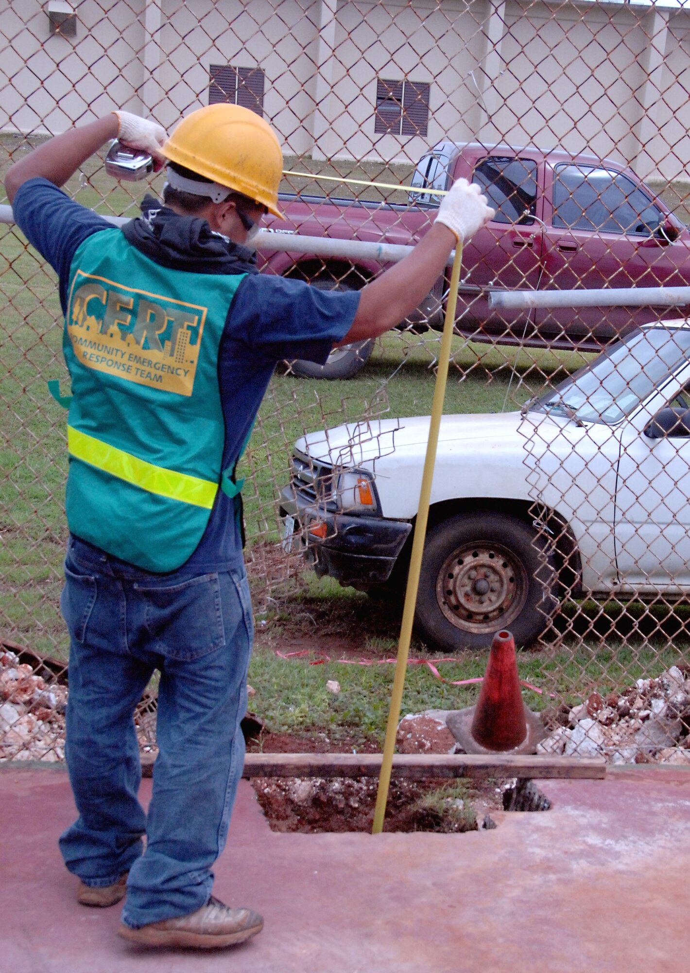 Local contractor, Richard Dizon, takes measurements for the installation of a new tennis net Oct. 21, at the tennis court here. As part of a quality-of-life improvement initiative, many Andersen attractions will be renovated in the near future. (U.S. Air Force photo/Airman Whitney Amstutz)