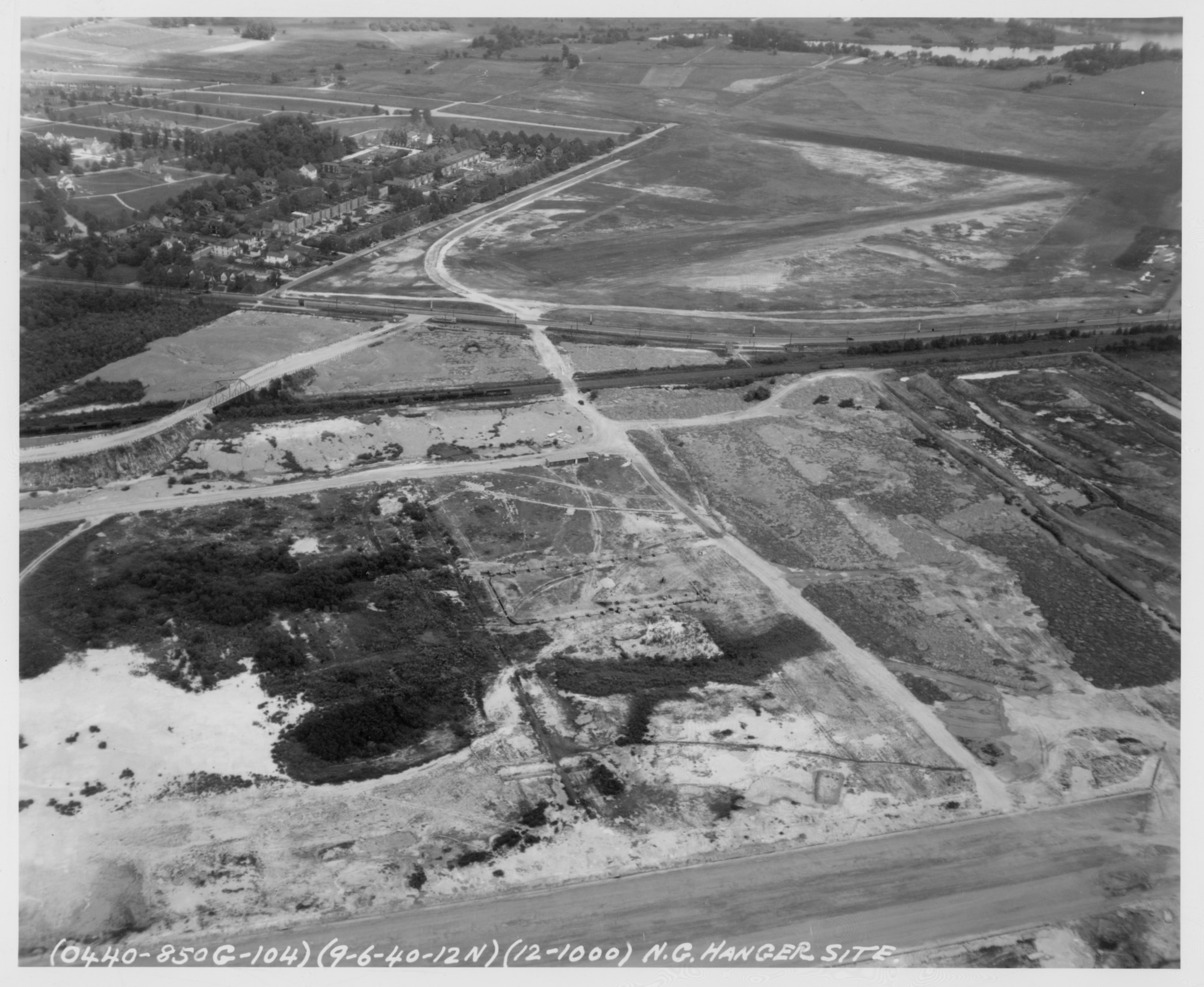 An aerial view of the Baltimore Municipal Airport (later renamed Harbor Field) under construction on Sept. 6, 1940. The location of the future National Guard hangar is visible near the center of the photo. Also visible, in the top half of the image, is Logan Field, the Maryland Air National Guard's first home base. (Released)