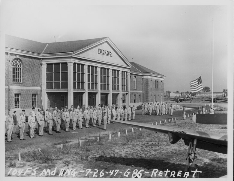 The Maryland Air National Guard's 104th Fighter Squadron holds a retreat ceremony at Baltimore Municipal Airport July 26, 1947. The 104th was reestablished there as part of the Maryland Guard following World War II and was based at the facility (later renamed Harbor Field) until 1957. (Released)