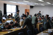 U.S. Air Force and Republic of Korea Air Force Airmen gather for a briefing Oct. 21 during exercise Max Thunder 10-02 at Kwangju Air Base, ROK. (U.S. Air Force photo/Master Sgt. Jason Wilkerson)