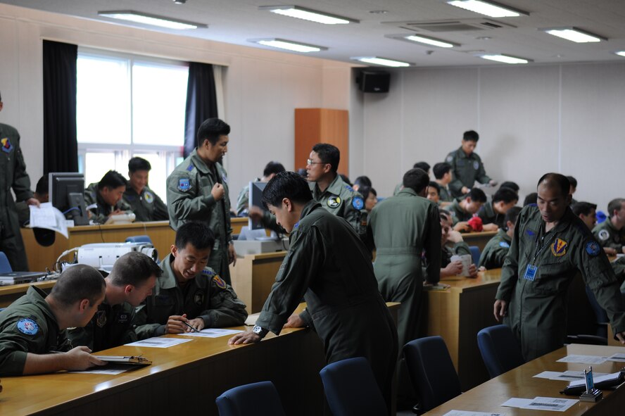 U.S. Air Force and Republic of Korea Air Force Airmen gather for a briefing Oct. 21 during exercise Max Thunder 10-02 at Kwangju Air Base, ROK. (U.S. Air Force photo/Master Sgt. Jason Wilkerson)