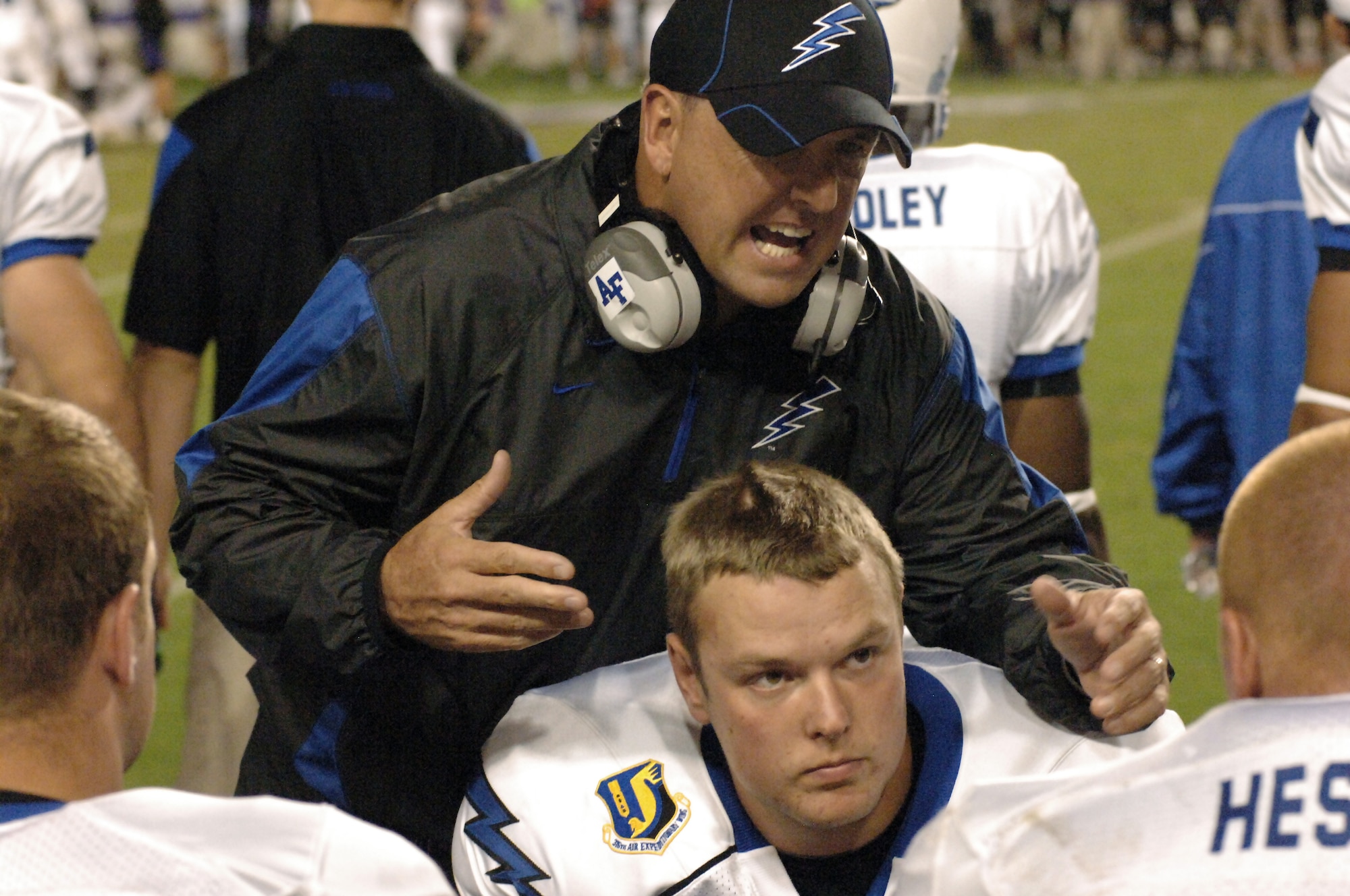 Air Force offensive line coach and co-offensive coordinator Clay Hendrix talks with his linemen following the Falcons' first and only successful scoring drive in a 38-7 loss to TCU at Amon G. Carter Stadium in Fort Worth Oct. 23, 2010. The Falcons' top-ranked rushing attack were held to less than 200 yards in the 38-7 loss to the fourth-ranked Horned Frogs. Coach Hendrix is a native of Commerce, Ga. (U.S. Air Force photo/John Van Winkle)