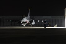 An F-16 Fighting Falcon from Kunsan Air Base, Republic of Korea, prepares to taxi to the runway for a Max Thunder 10-2 night mission Oct. 20 at Kwangju AB, ROK. (U.S. Air Force photo/Staff Sgt. Eric Burks)