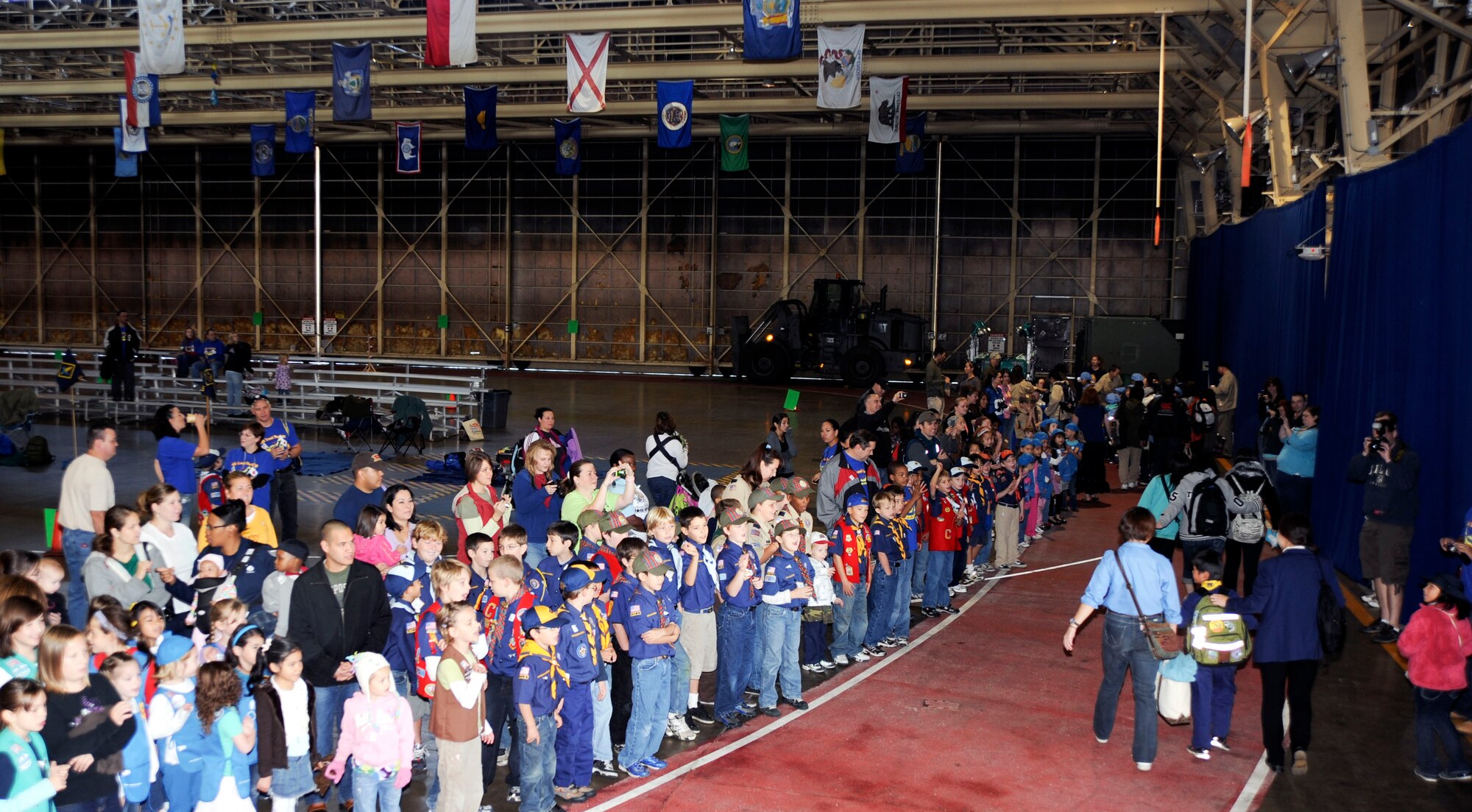 American Scouting family members welcome Japanese Scouting families to International Scout Day at Misawa Air Base, Japan, Oct. 23, 2010.  Nearly 800 International members attended, making the 51st year Misawa AB has hosted the event. (U.S. Air Force photo by Tech. Sgt. Russell McBride/Released)