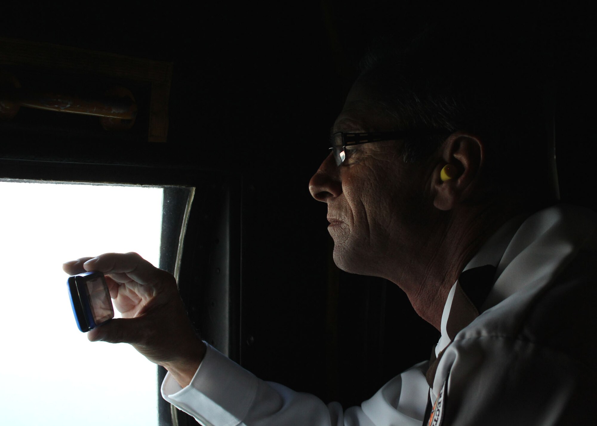 Lieutenant Andrew Williams, an employer with the Santa Rosa County Department of Corrections, takes a photo of the Emerald Coast while flying aboard a Duke Field MC-130E Oct. 7.  The local area flight was part of the 919th Special Operations Wing’s Employer Appreciation Day Oct. 7.  The annual event invites civilian employers to see how their reservist “Citizen Commandos” defend America’s interests on a global scale. (U.S. Air Force photo/Adam Duckworth)