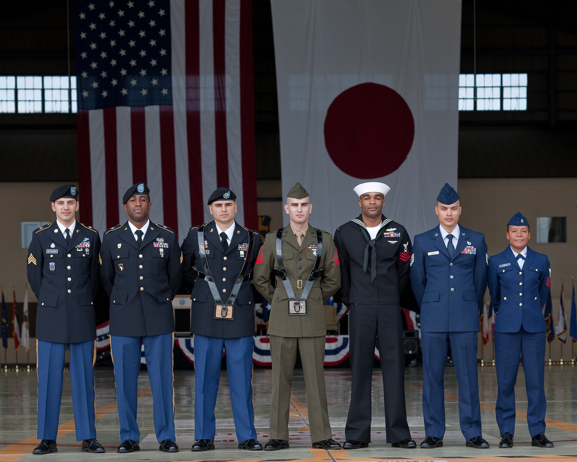 YOKOTA AIR BASE, Japan -- Joint service members from the United States Forces, Japan and Fifth Air Force prepare to post the colors as part of USFJ and 5 AF change of command ceremony here Oct. 25 at Hangar 15. Lt. Gen. Burton Field assumed command of USFJ and 5AF. (U.S. Air Force photo/Osakabe Yasuo)