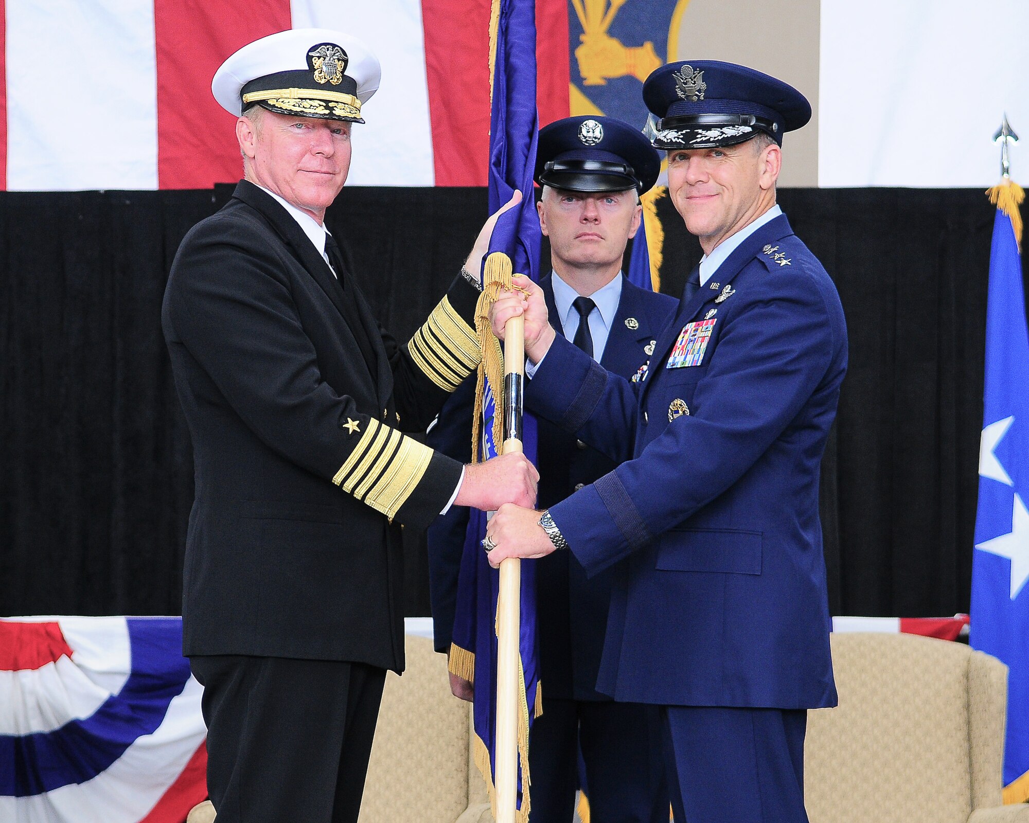 YOKOTA AIR BASE, Japan -- Admiral Robert Willard, commander, U.S. Pacific Command, (left) passes the United States Forces, Japan guidon to Lt. Gen. Burton Field (right) the incoming USFJ and Fifth Air Force commander, here Oct. 25, during the change of command ceremony. General Field, the former Senior Advisor to the U.S. Special Representative for Afghanistan/Pakistan, the Pentagon, Washington, D.C., replaced Lt. Gen. Edward A. Rice Jr., who will assume duties as the next Commander, Air Education and Training Command, Randolph Air Force Base, Texas.
(U.S. Air Force photo/Staff Sgt. Stacy Moless)