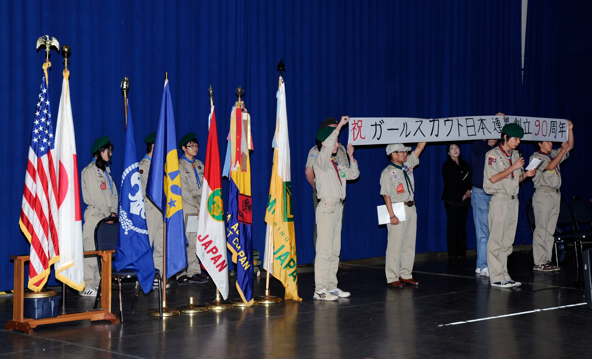 A member of Japans Boy Scouts congratulates the Girl Scouts on their 90th anniversary during open ceremonies of the International Scout Day at Misawa Air Base, Japan, Oct. 23, 2010. International Scouting is the largest voluntary youth movement in the world with a membership of more that 28 million Boy and Girl Scouts in 218 countries.  (U.S. Air Force photo by Tech. Sgt. Russell McBride/Released)